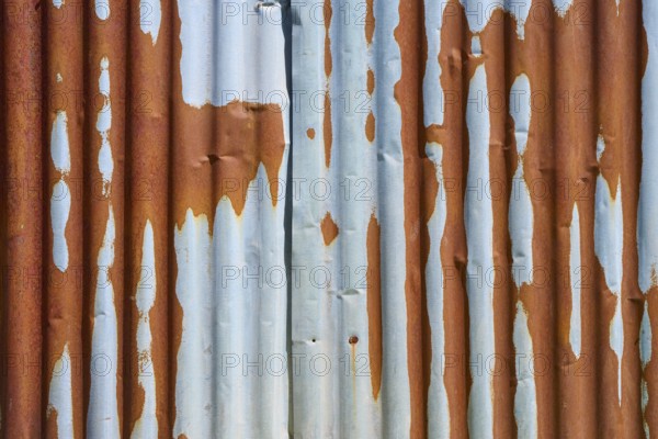 Rusty metal sheets with peeling rust and texture that indicate weathering, Germany