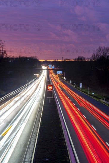Motorway A40, Ruhrschnellweg, near Bochum, dense evening traffic, in front of the motorway junction Bochum, A43, view in west direction, North Rhine-Westphalia, Germany
