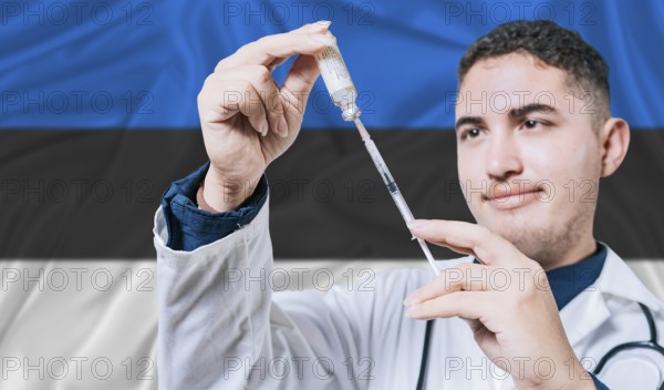 Doctor holding syringe on Estonia flag background. Medical professional holding syringe with Estonian flag in the background