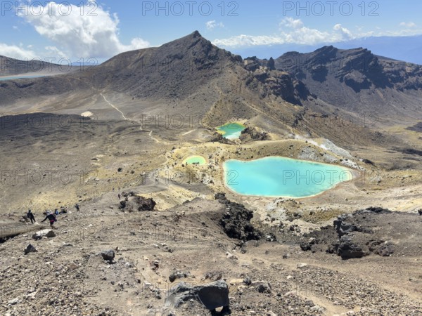 On the hiking trail of the Tongariro Alpine Crossing in Tongariro National Park with a view of the Emerald Lakes, North Island, New Zealand, Oceania