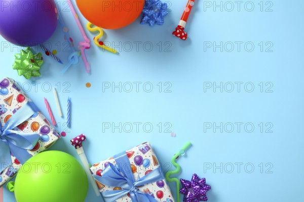 Bright birthday party decorations on blue background. Happy Birthday greeting card template. Flat lay, top view