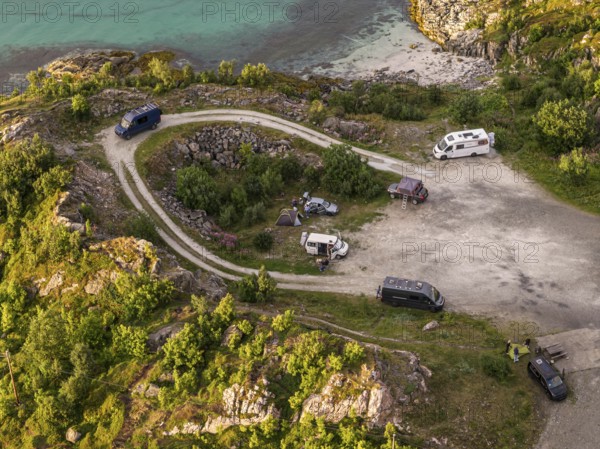Rest area at Sommaroy Bridge, camper vans, sunset, aerial view, Norway