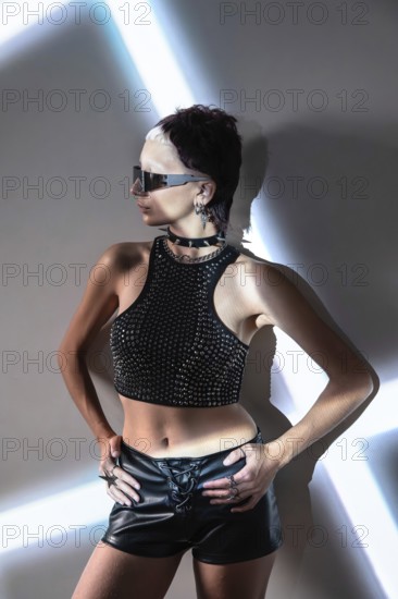 A futuristic cyberpunk fashion model showcases an edgy and dynamic look with metallic accents, bold accessories, and a confident stance, embodying a sci-fi aesthetic