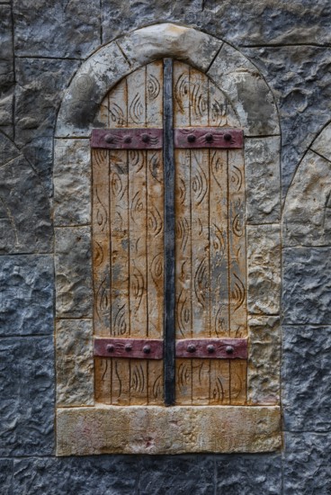 Stone wall with closed wooden window, Plakias, south coast, Crete, Greece