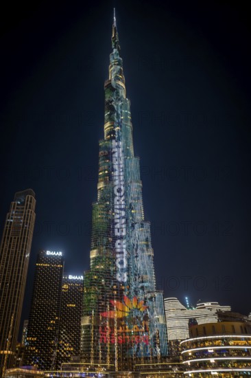 Night shot, illuminated advertising at the Burj Khalifa, Downtown, Dubai, United Arab Emirates