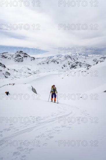 Ski tourer in mountain landscape with snow, ascent to Grialetsch Scharte, Bündner Haute Route, Albula Alps, Rhaetian Alps, Grisons, Switzerland
