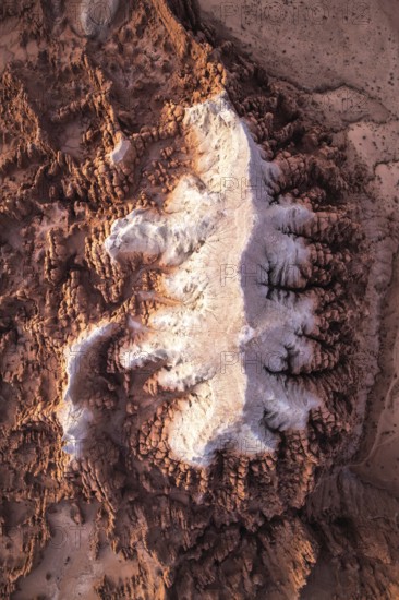 This stunning aerial image captures the intricate, textured sandstone formations of Goblin Valley State Park in Utah, showcasing nature's artistry with its varied hues and rugged landscape