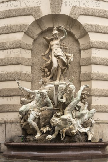 Fountain sculpture Power to the Sea, St Michael's Wing of the Hofburg Imperial Palace Palace in Vienna, Austria