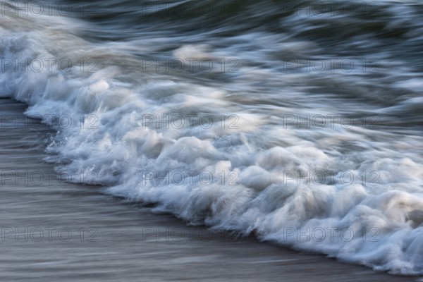 Wave play at sunrise on the chalk coast in Jasmund National Park, Rügen, Sassnitz, Mecklenburg-Western Pomerania, Germany