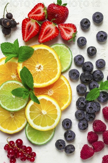 Mix of fruits and berries, set, assortment, sliced citrus fruits, raspberries, blueberries, mint leaves, strawberries, red currants, food background, fruit wallpaper