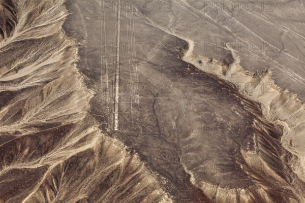 Dry, rocky landscape with line drawings captured from the air, the geoglyphs and drawings in the desert near Nasca and Palpa in Peru