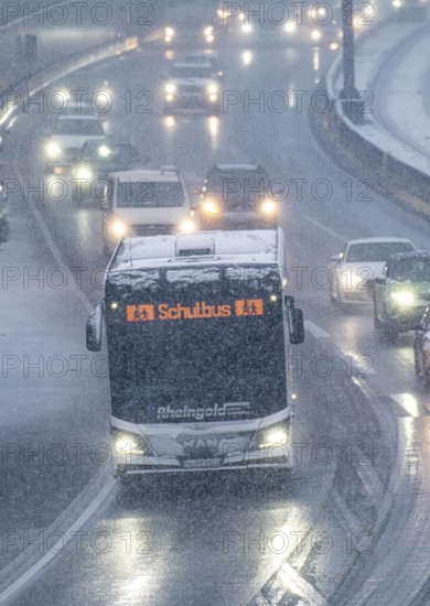 Winter weather, heavy snowfall, traffic jam on the A40 motorway in Essen, school bus, North Rhine-Westphalia, Germany