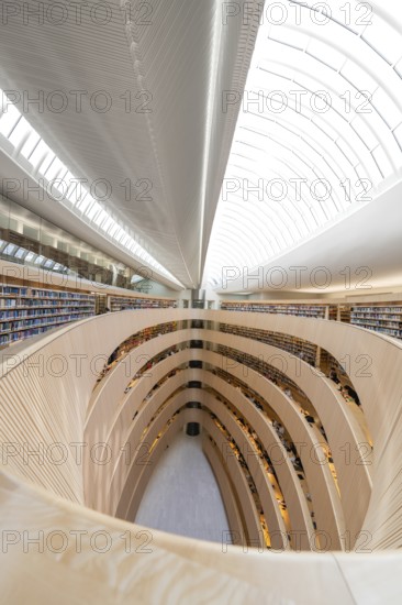 Large, modern library with spiral-shaped architecture and bright glass roof, University Law Library, Zurich, Switzerland