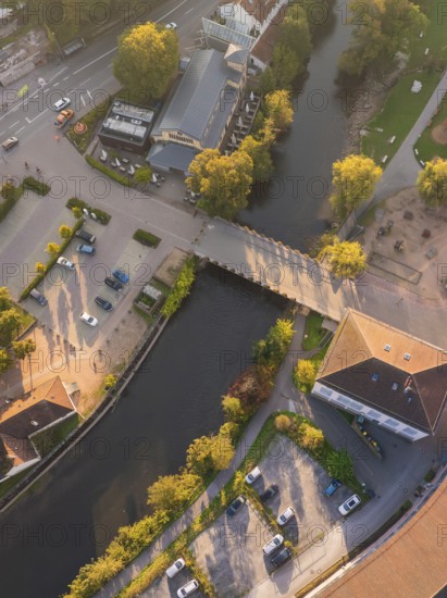 Aerial view of a section of a river with a bridge and surrounding buildings, Calw, Black Forest, Germany
