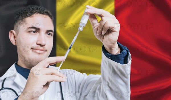 Doctor holding syringe on Belgium flag background. Medical professional holding syringe with Belgian flag in the background