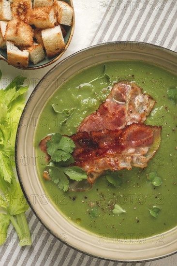Green mashed soup, with bacon and croutons, homemade, no people