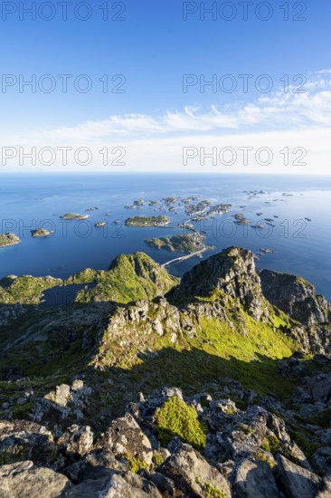 View of numerous small rocky islands with houses, at the summit of Festvågtind, view of Henningsvær, Vågan, Lofoten, Nordland, Norway