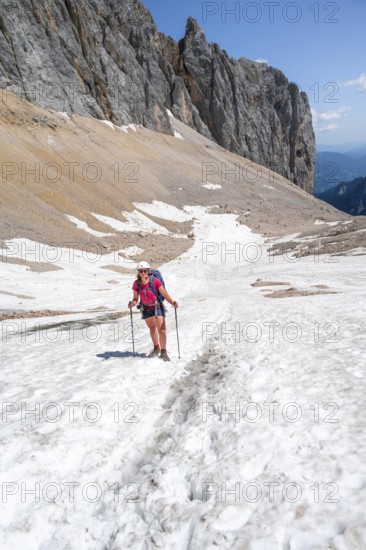 Mountaineer on a snowfield, mountain basin with glacier remnant of the Höllentalferner, Höllental, rocky mountain peaks, Höllental, Bavaria, Germany