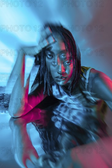 A futuristic portrait of a young African woman in a vibrant, digital metaverse. The image blends technology and style, showcasing a colorful and immersive virtual experience