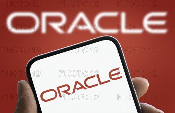 Oracle logo is diaplayed on smartphone. Oracle Corporation is an American multinational computer technology company.