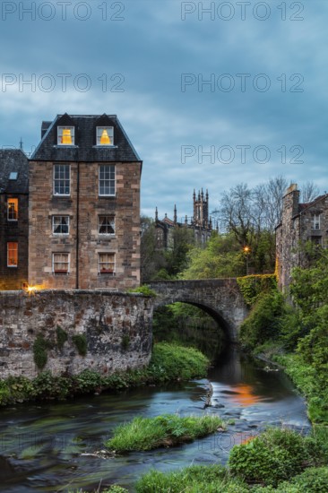Dean Village, Edinburgh, Scotland, UK. Traditional houses and church with canal in historic Dean Village