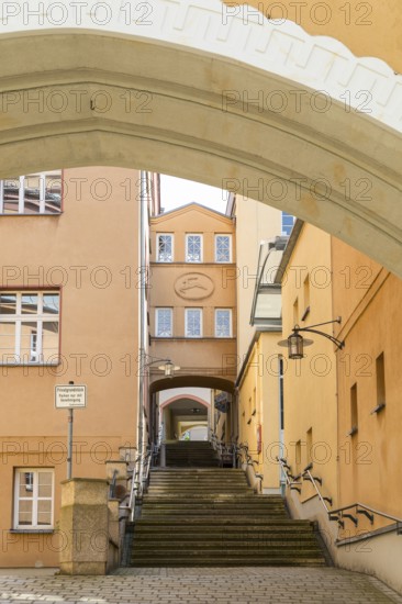 Archway at the New Town Hall with stairs at the portico, the passageway to the AltmarktLichtenstein, Saxony, Germany