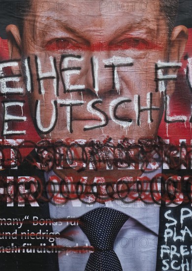Denigration of a large poster for the 2025 federal election by the SPD with Olaf Scholz, Witten, North Rhine-Westphalia, Germany