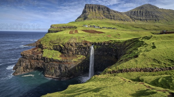 Mulafossur, waterfall and village view, Faroe Islands, Faroe Islands, Denmark