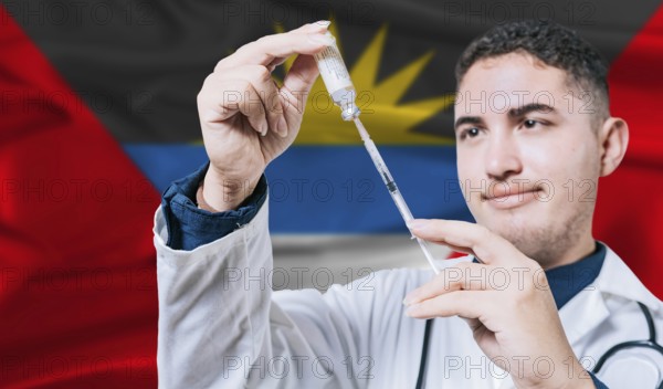 Doctor holding syringe on Antigua and Barbuda flag background. Medical professional holding syringe with Antiguan flag in the background