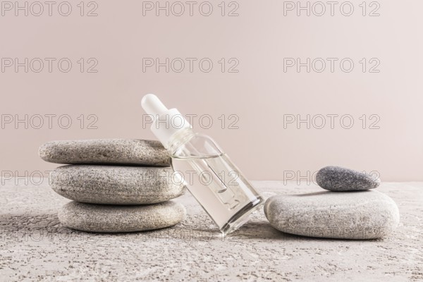 A minimalistic scene featuring a clear glass serum bottle on stone layers, embodying harmony and tranquility Perfect for skincare or spa-themed concepts