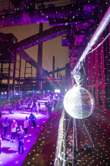 Ice rink at the Zollverein coking plant, ice skating with music and many lighting effects, Essen, North Rhine-Westphalia, Germany
