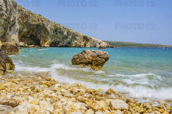 Romantic view over the sea in Koromacna Bay on a sunny day with rough seas on the island of Cres, long exposure, Croatia
