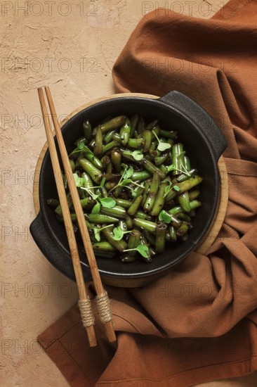Fried bean pods, in soy sauce, with sesame seeds, homemade, no people