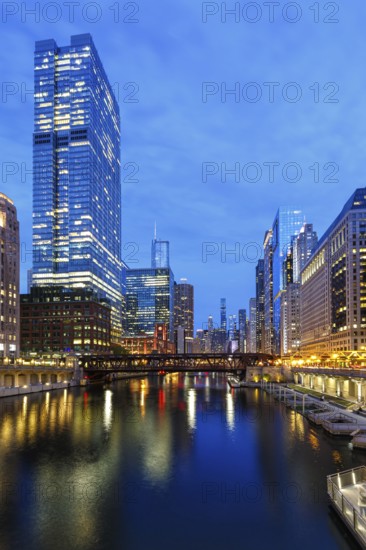 Skyline skyscrapers skyscrapers on the Chicago River bridge at night in Chicago, USA