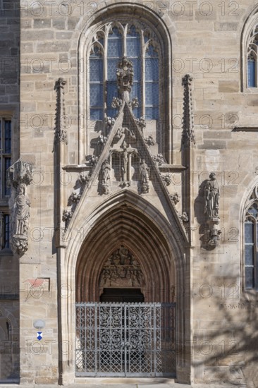 Gothic side entrance portal with the tympanum of the Entombment of Mary, St Andrew's Church, Weißenburg, Middle Franconia, Bavaria, Germany