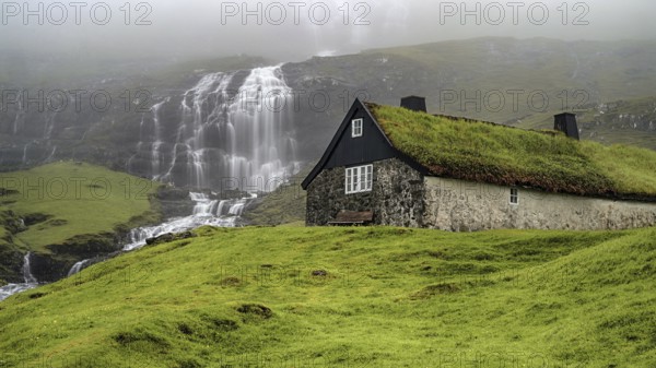 The waterfall with a view of Saksun, Faroe Islands, Denmark, Faroe Islands, Denmark