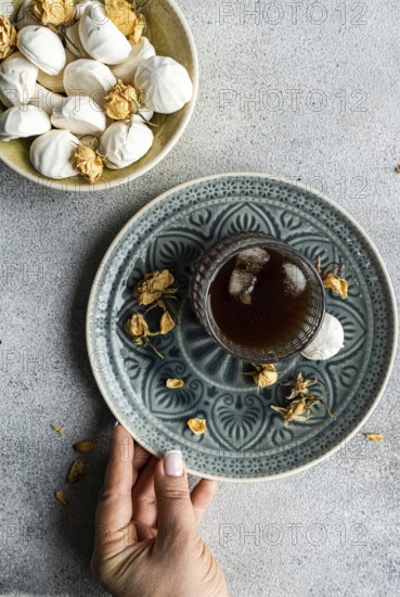 Indulge in homemade vanilla mini zephyr-marshmallows filled with delectable rose jam Paired perfectly with a refreshing iced coffee liqueur drink, creating a delightful treat