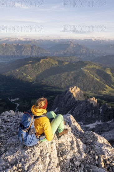 Hiker looking down into the valley from the Hochkönig, Tyrol, Austria