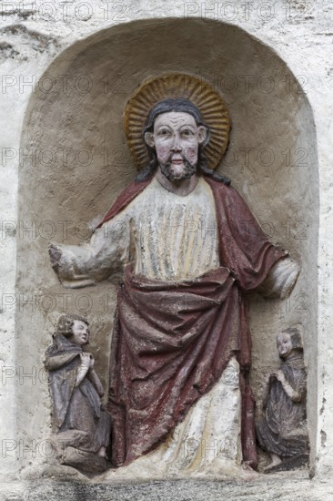 Blessing Christ, figure above the entrance, early Romanesque monastery church of St. Cyriak, Sulzburg, Markgräflerland, Upper Black Forest, Baden-Württemberg, Germany