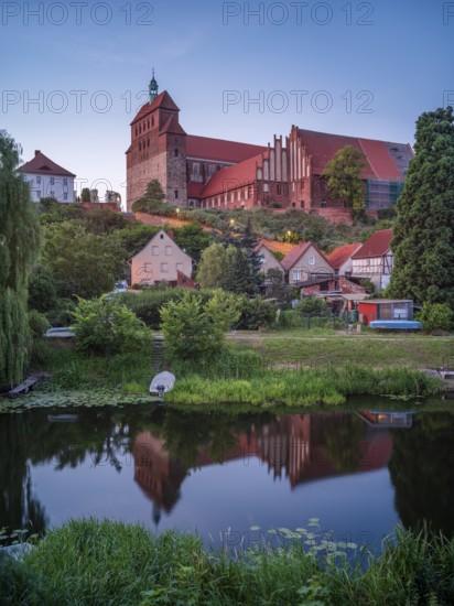 Havelberg Cathedral of St Mary at dusk, reflection in the moat, brick architecture, Hanseatic town of Havelberg, Saxony-Anhalt, Germany