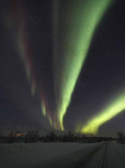 Rising Northern Lights over Finnish Lapland