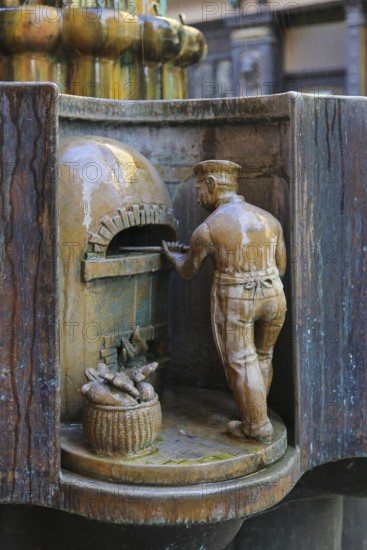 Guild fountain by the sculptor Bonifatius Stirnberg from 1983, guilds, guilds, craftsmen, cast figure, baker, baking oven, Reutlingen, Baden-Württemberg, Germany