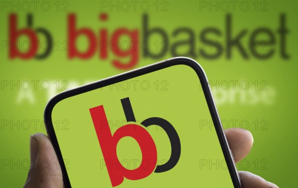 BigBasket logo is displayed on smartphone. BigBasket is an Indian online grocery.