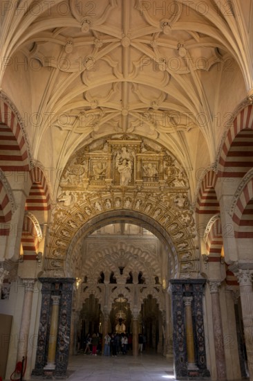 A richly decorated interior of the cathedral mosque of Córdoba (Mezquita-Catedral), with Gothic vaults and detailed arches, Cordoba, Andalusia, Spain