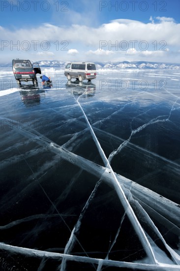 Cars on ice, Lake Baikal, Olkhon Island, Pribaikalsky National Park, Irkutsk Province, Siberia, Russia