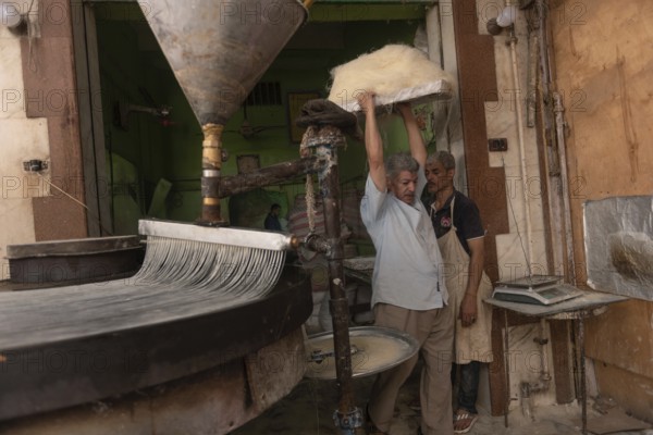Rosetta, Egypt. June 27th 2024 Preparation of filo dough to make Egyptian Knafeh and Qatayef a popular sweet desert often eaten after the fast during the holy month of Ramadan, Egypt