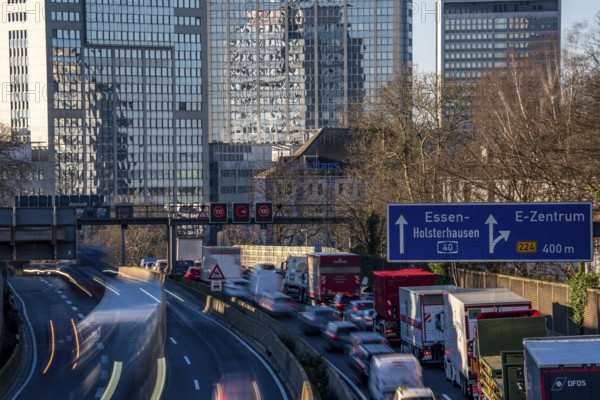 The A40 motorway, Ruhrschnellweg, in Essen, city skyline, Evonik office building, traffic jam in the westbound lane, Duisburg, slow traffic, North Rhine-Westphalia, Germany