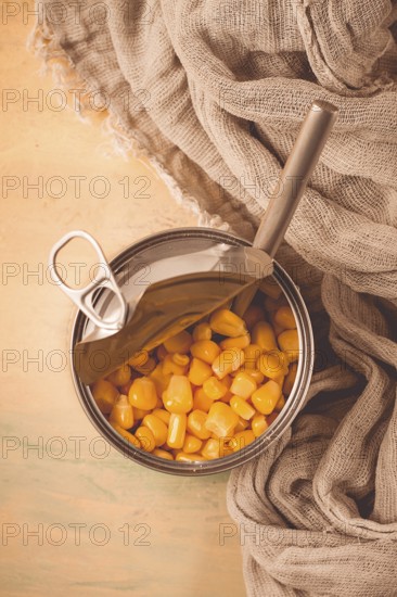 Open tin can, with corn, top view, selective focus, no people, close-up