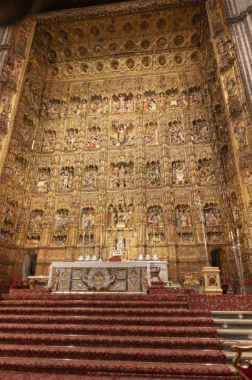 Magnificent baroque altar with rich decorations and religious motifs, Seville, Andalusia, Spain