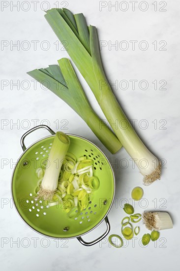 Leek, leek sticks and leek rings in a sieve bowl